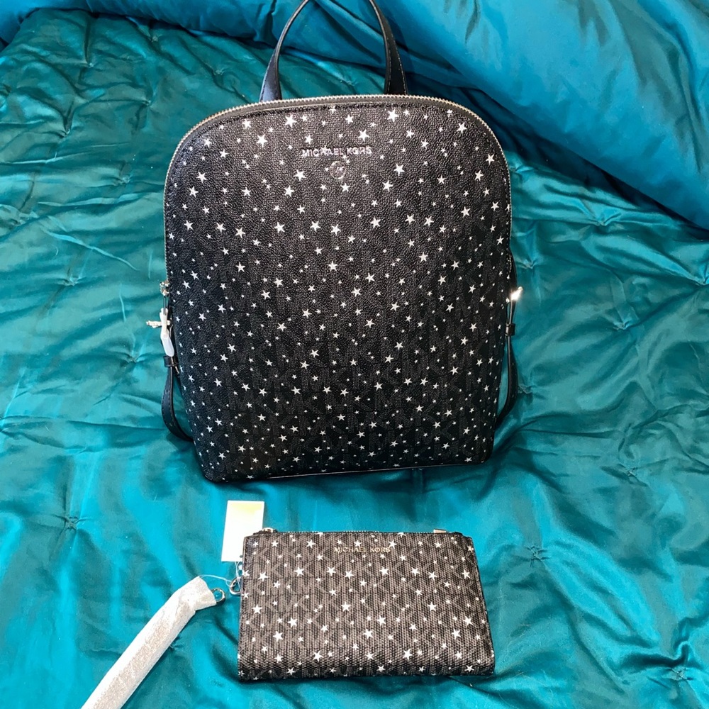 Brand New Michale Kors backpack style purse with wallet.